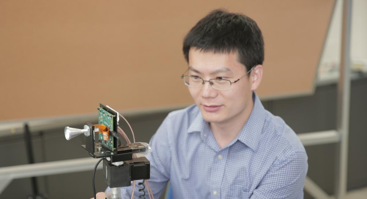 Xinyu Zhang shown with the WiMi antenna